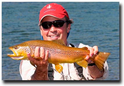 Alberto Cordero with a nice Brown Trout landed on a dry fly.