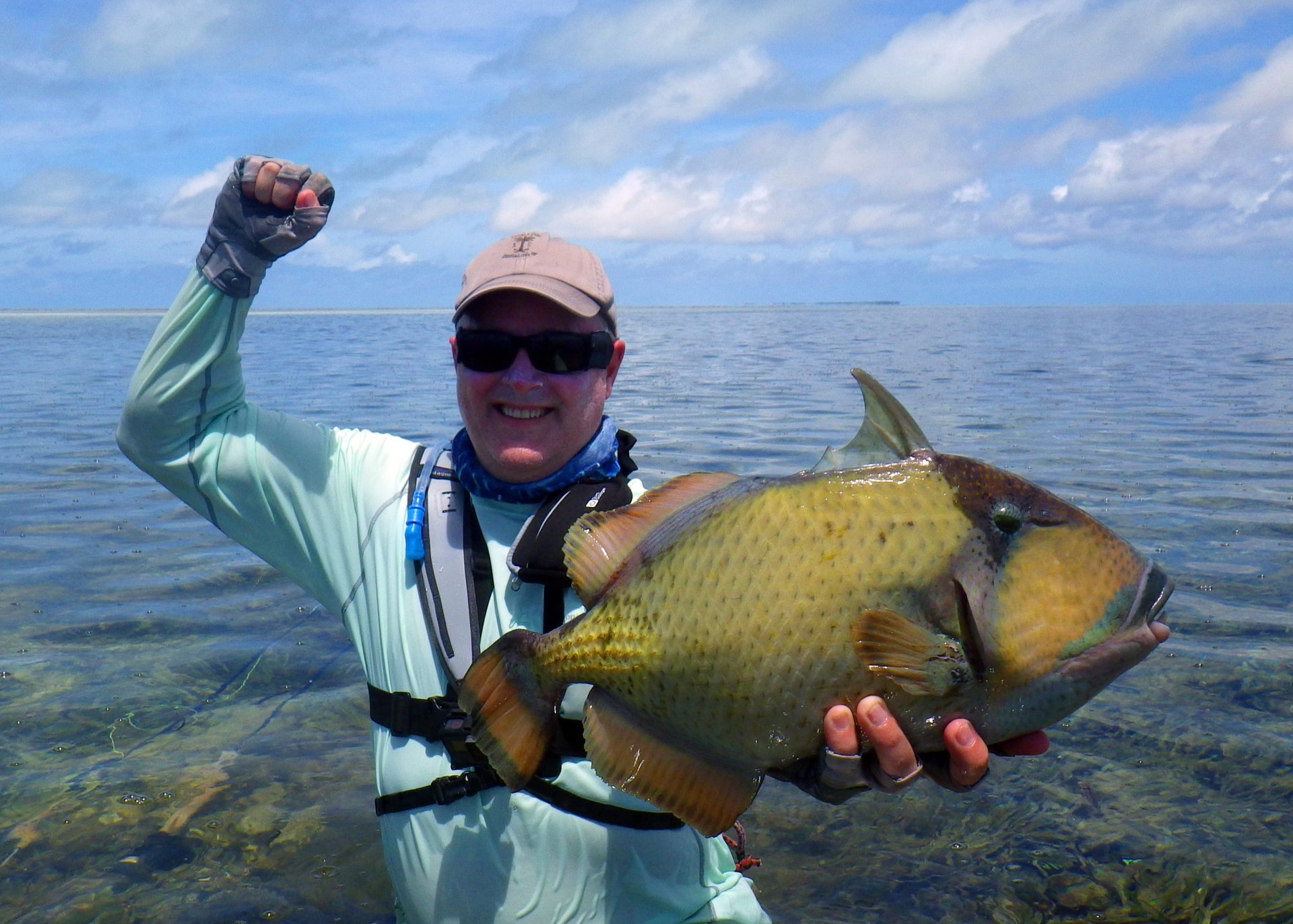 Angler with a triggerfish on a Seychelles flat