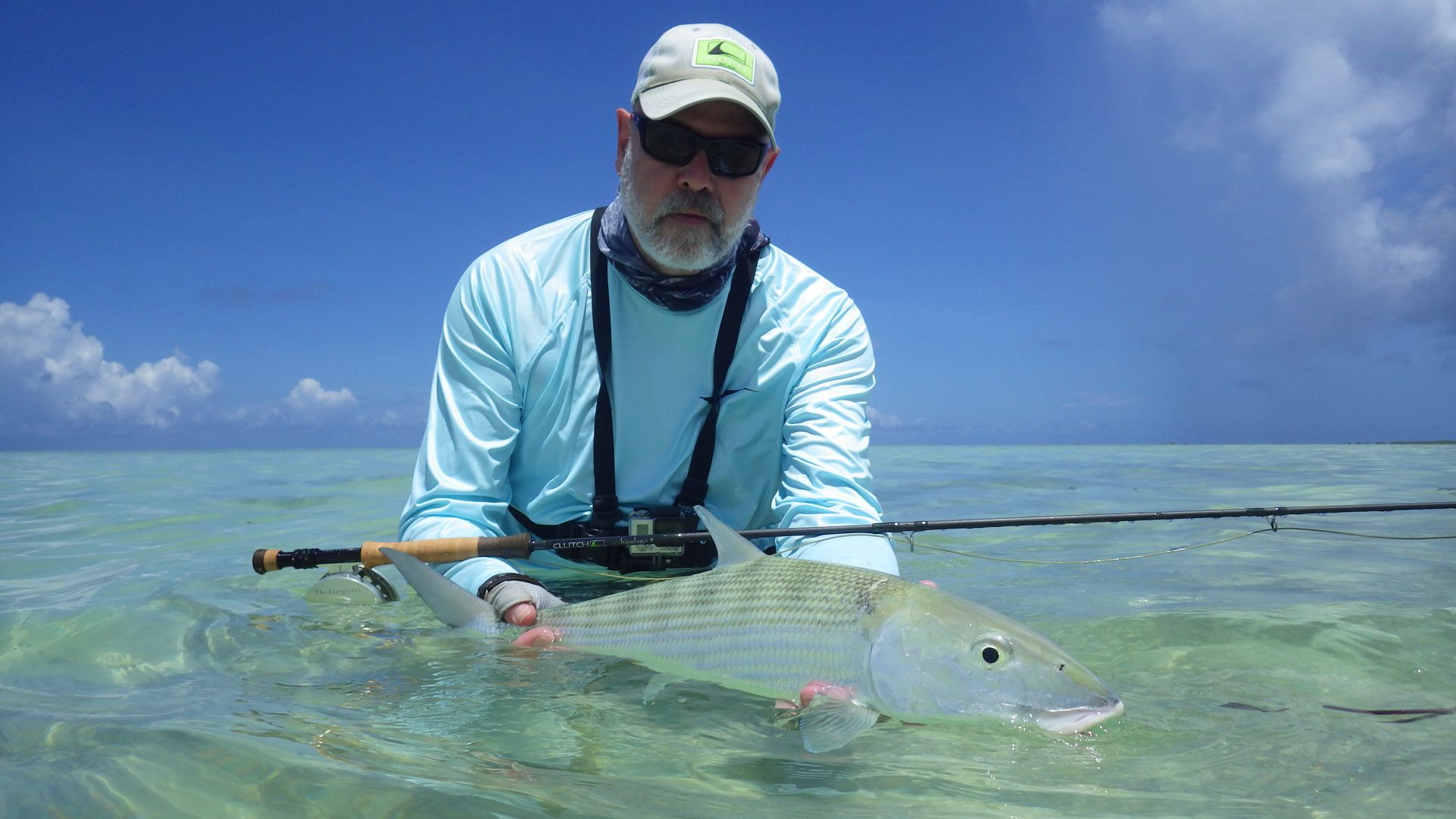 Angler with a bonefish on a Seychelles flat