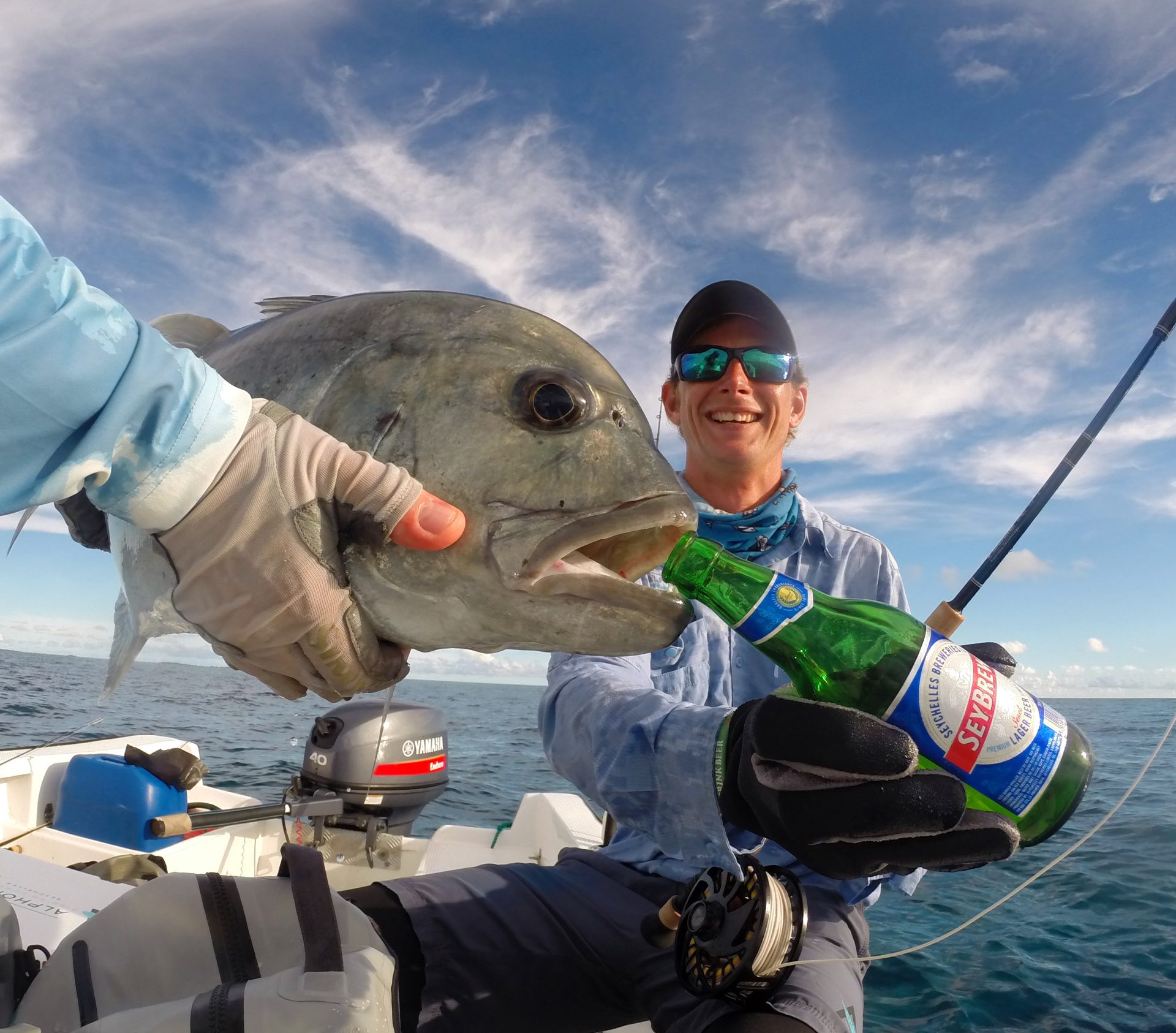 Anglers celebrating a Giant Trevally in the Seychelles