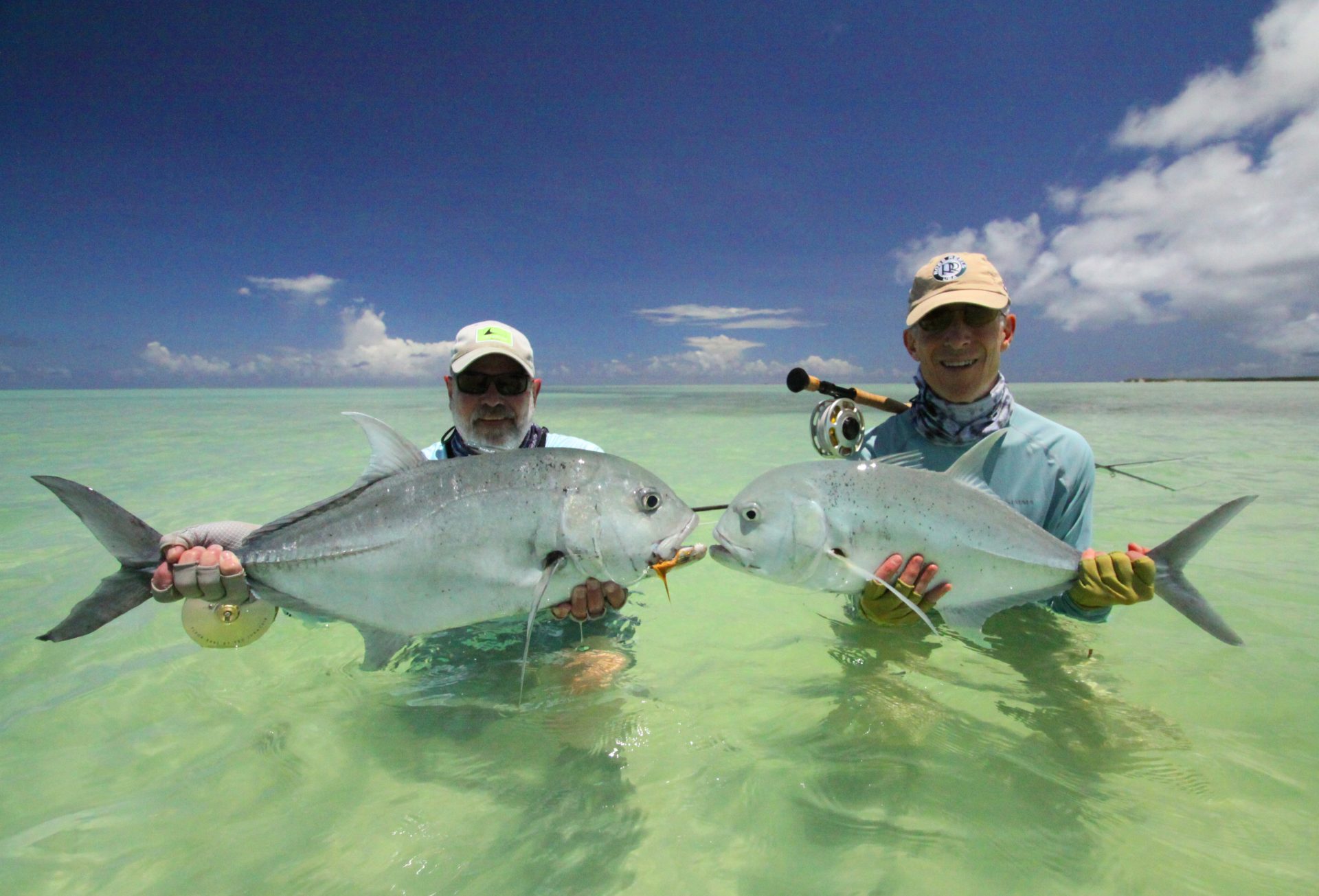 Two anglers with a catch on a Seychelles flat
