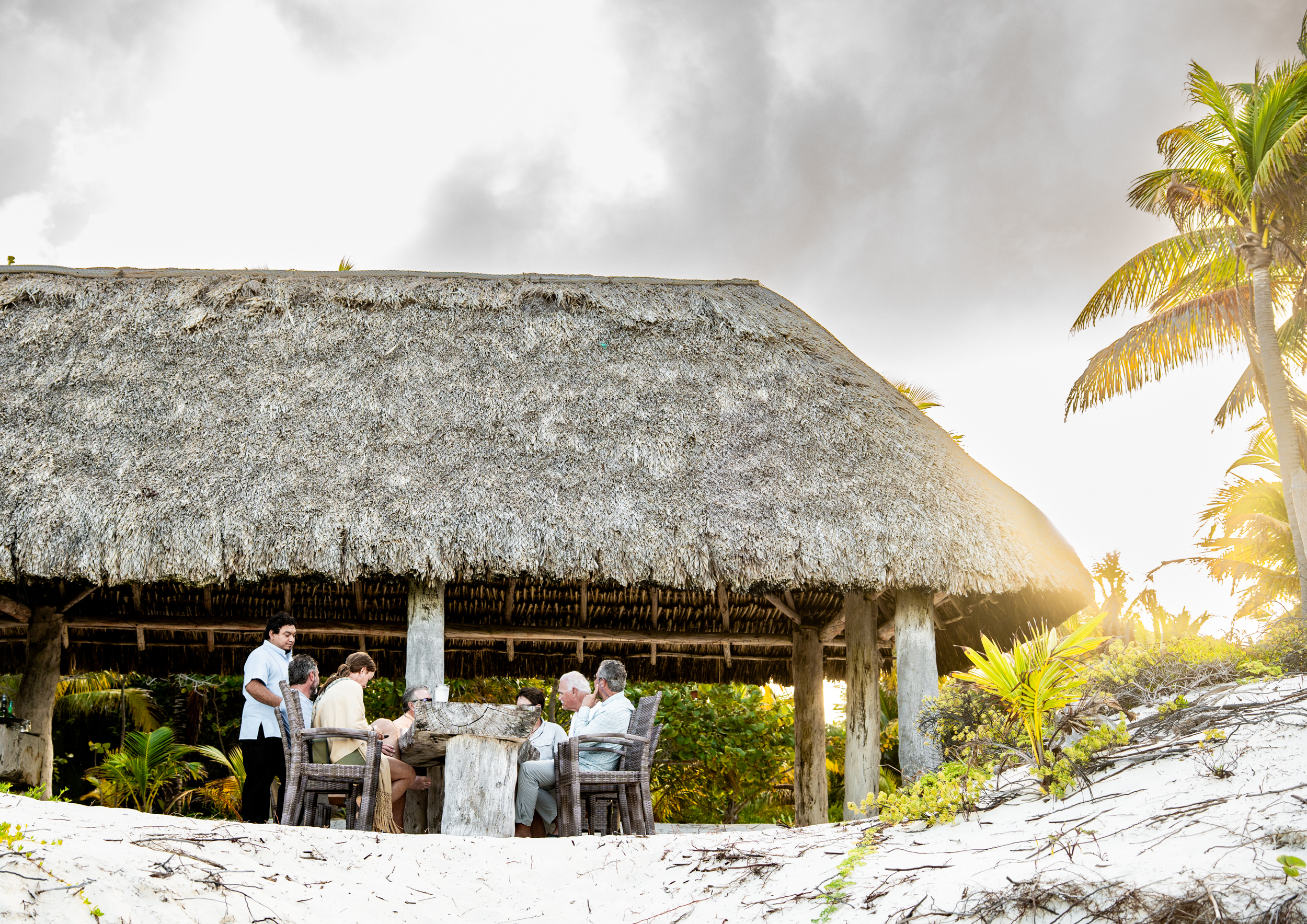 Outdoor dining under a palapa at Playa Blanca Lodge, Espiritu Santo Bay Mexico | Matt DeLorme