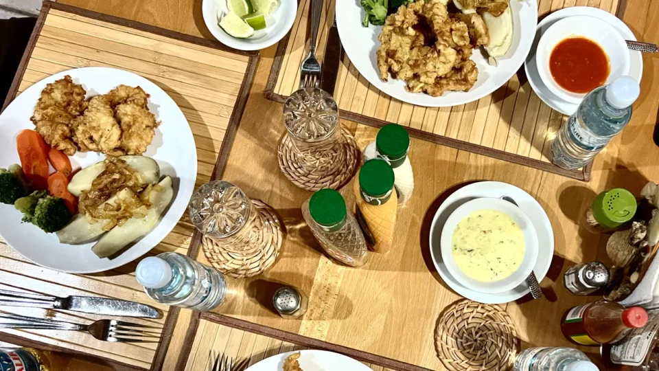 Bahamian dinner with fried seafood and vegetables at Grey’s Point Inn, Acklins Island, Bahamas
