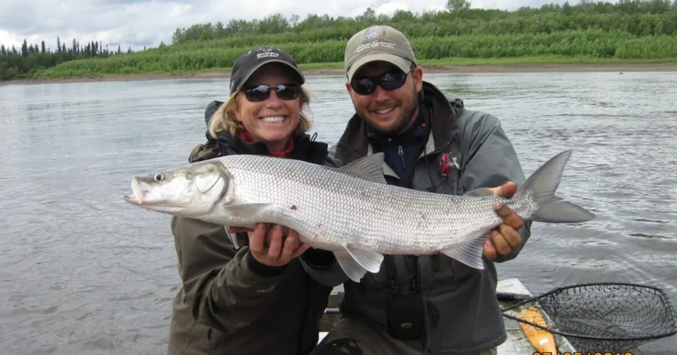 Angler with salmon — Royal Coachman Lodge, Nuyakuk River, Bristol Bay, Alaska