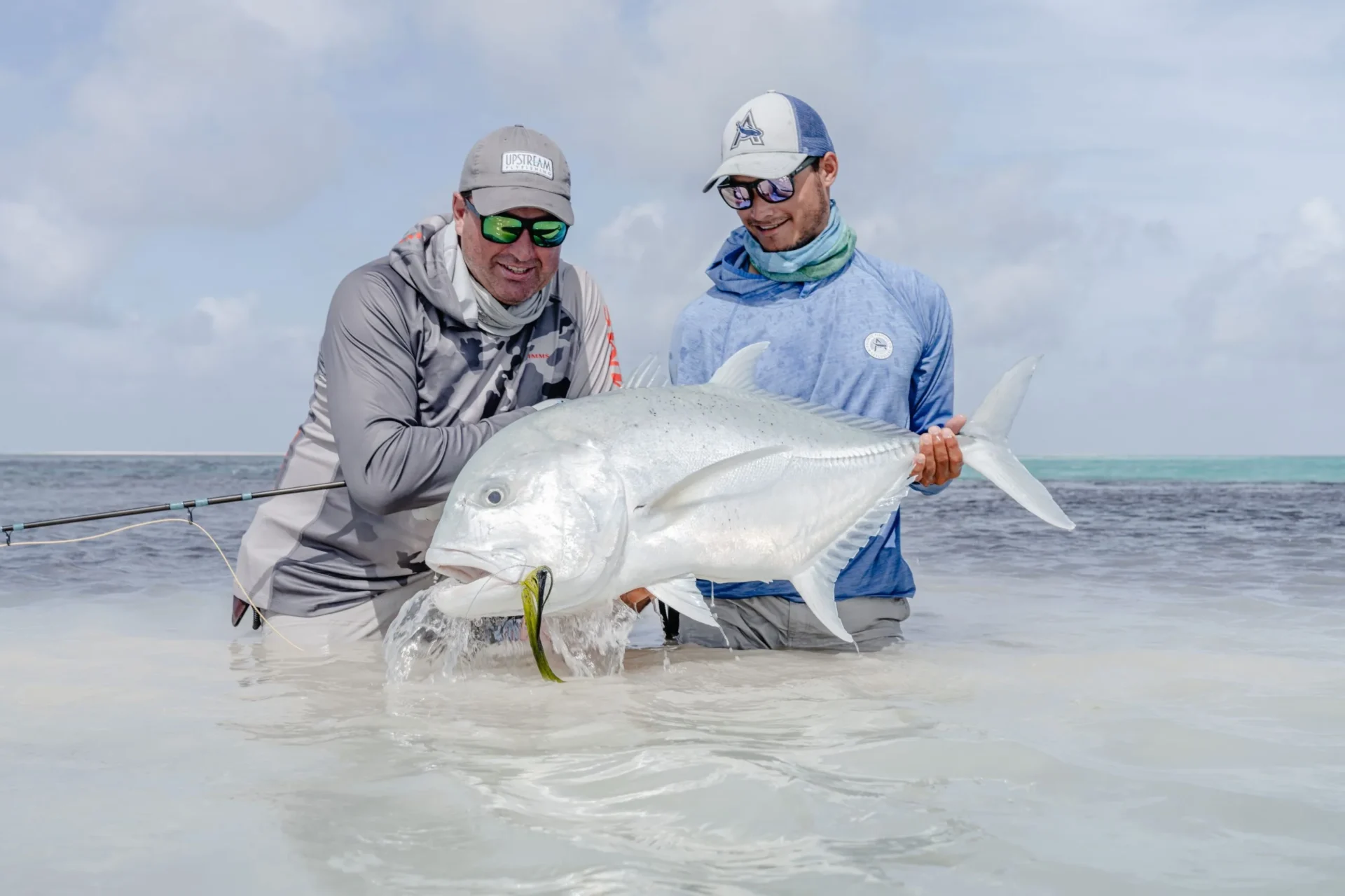 Angler with Giant Trevally — Alphonse Island, Seychelles