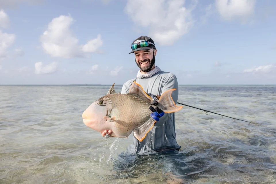 Angler with a triggerfish — Alphonse Island, Seychelles
