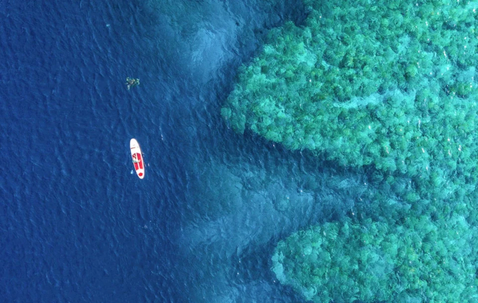 Aerial of a skiff on the reef drop off — Astove Atoll, Seychelles
