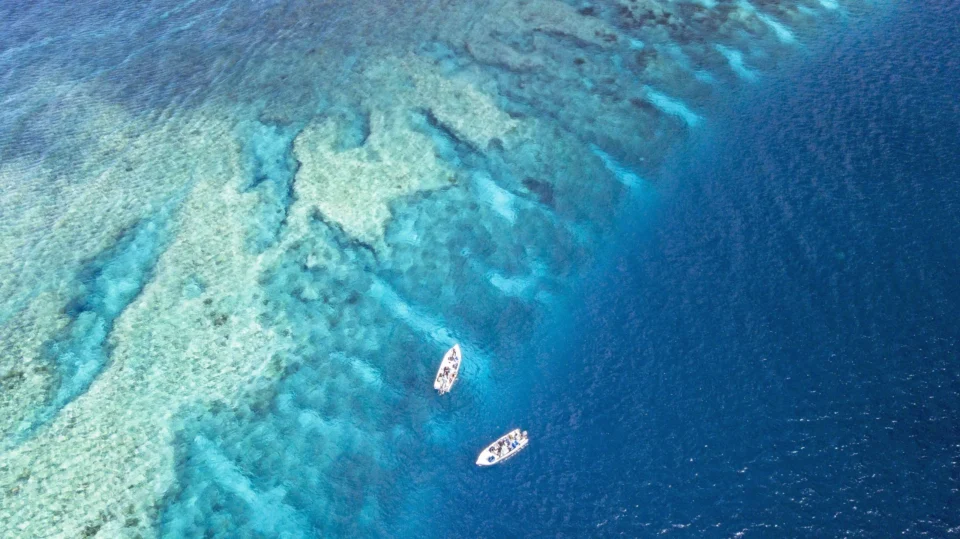 Aerial of two skiffs at the reef edge — Astove Atoll, Seychelles