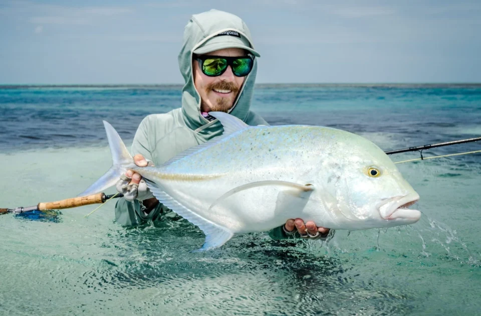 Angler with a bluefin trevally — Astove Atoll, Seychelles