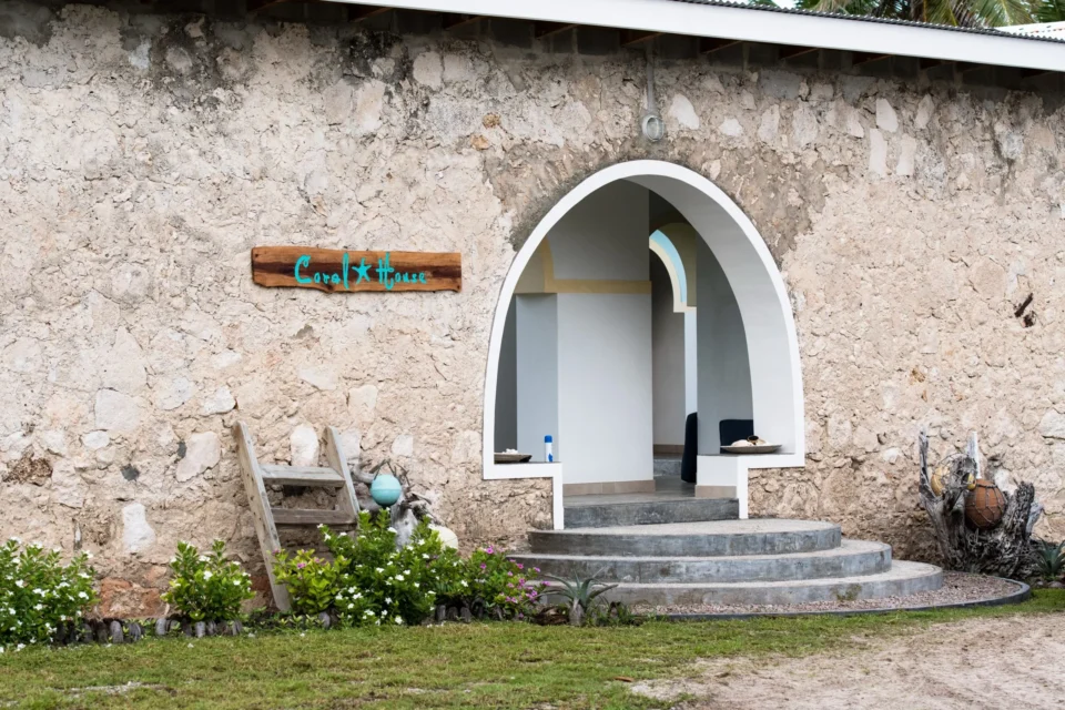 Arched stone entrance to the lodge — Astove Atoll, Seychelles