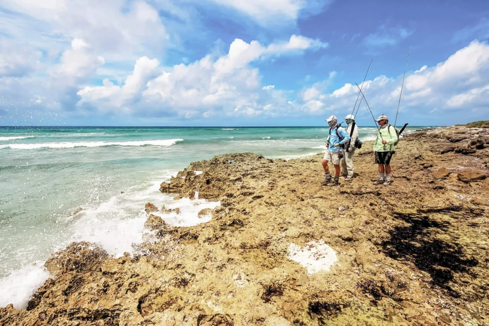 Two anglers walking the outer reef — Astove Atoll, Seychelles