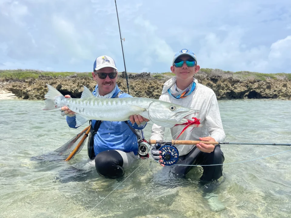 Two anglers with a great barracuda — Astove Atoll, Seychelles