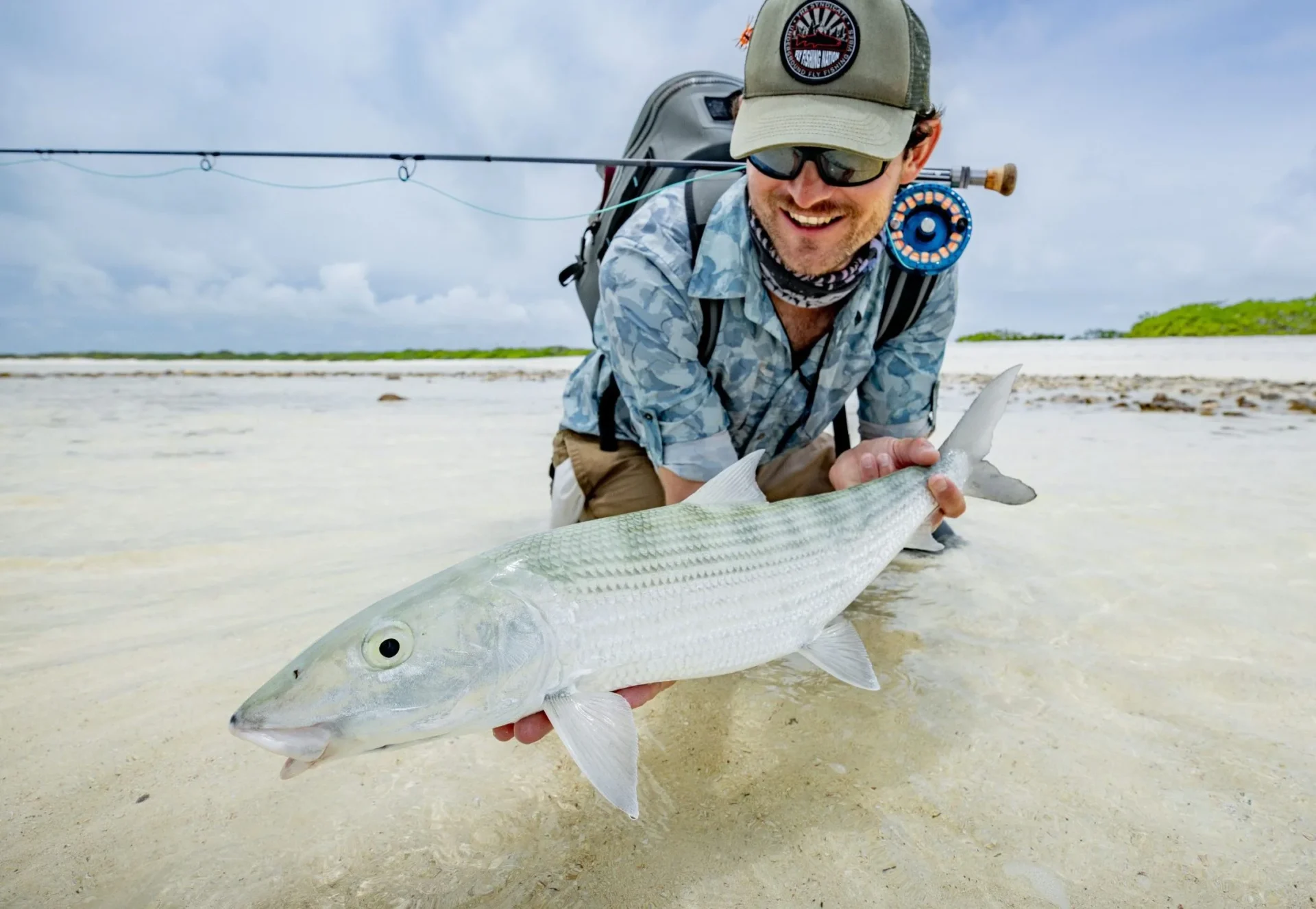 Angler releasing a bonefish on the flats — Farquhar Atoll, Seychelles