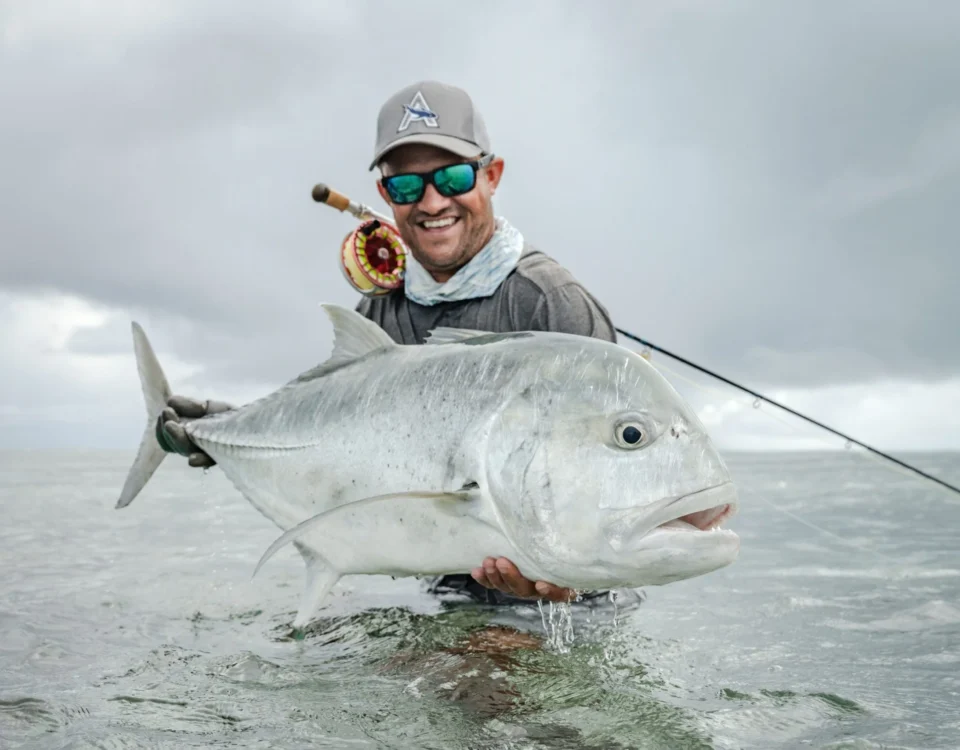 Angler with a giant trevally — Farquhar Atoll, Seychelles