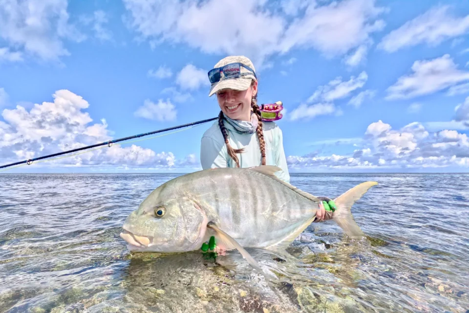 Angler with a trevally on the flats — Farquhar Atoll, Seychelles
