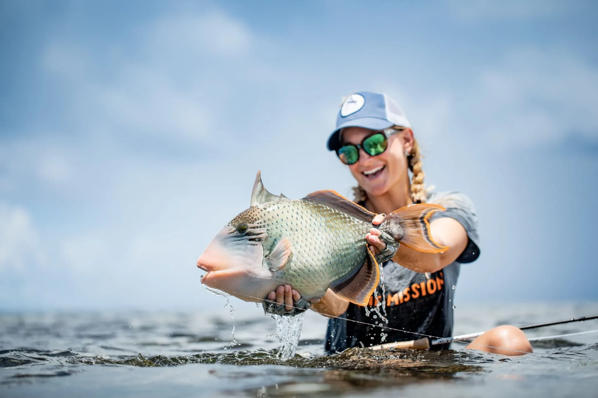 Angler with a yellowmargin triggerfish in the shallows — Farquhar Atoll, Seychelles