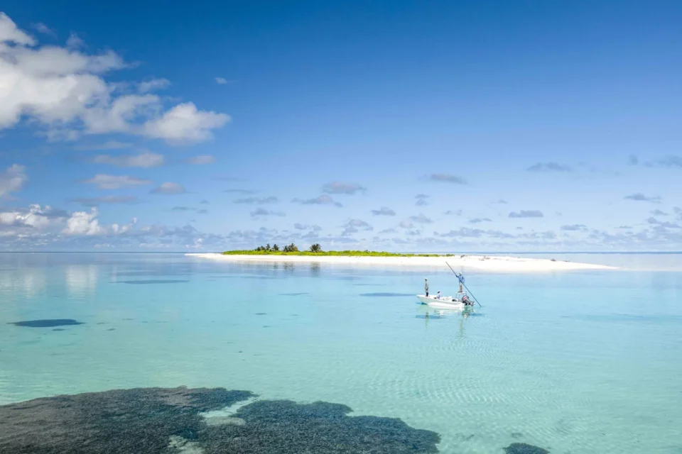 Skiff on the turquoise flats — Farquhar Atoll, Seychelles