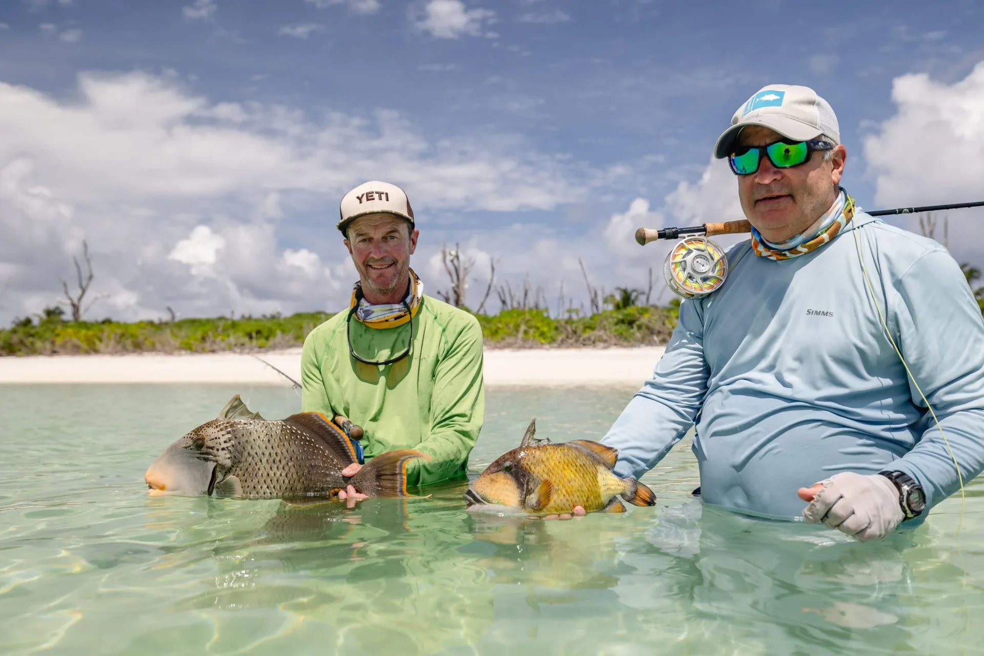 Two anglers with triggerfish on the flats — Farquhar Atoll, Seychelles