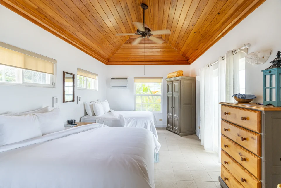 Cottage bedroom with two queen beds at Mangrove Cay Club, Andros, Bahamas