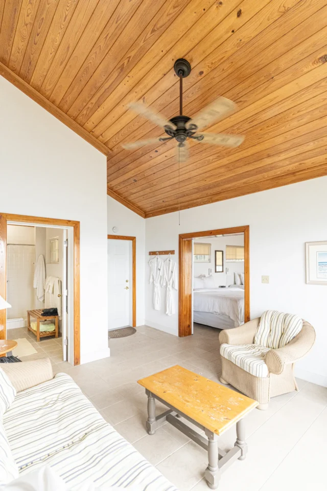 Cottage suite sitting area, bath, and bedroom at Mangrove Cay Club, Andros, Bahamas
