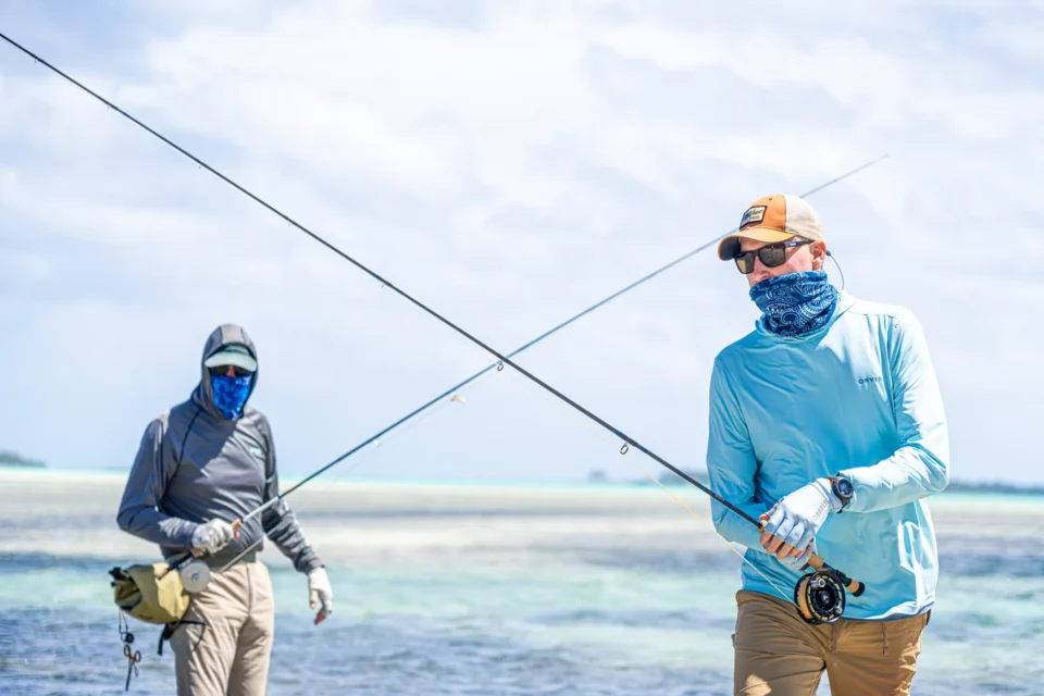 Two anglers wading and fly casting at Mangrove Cay Club, Andros, Bahamas