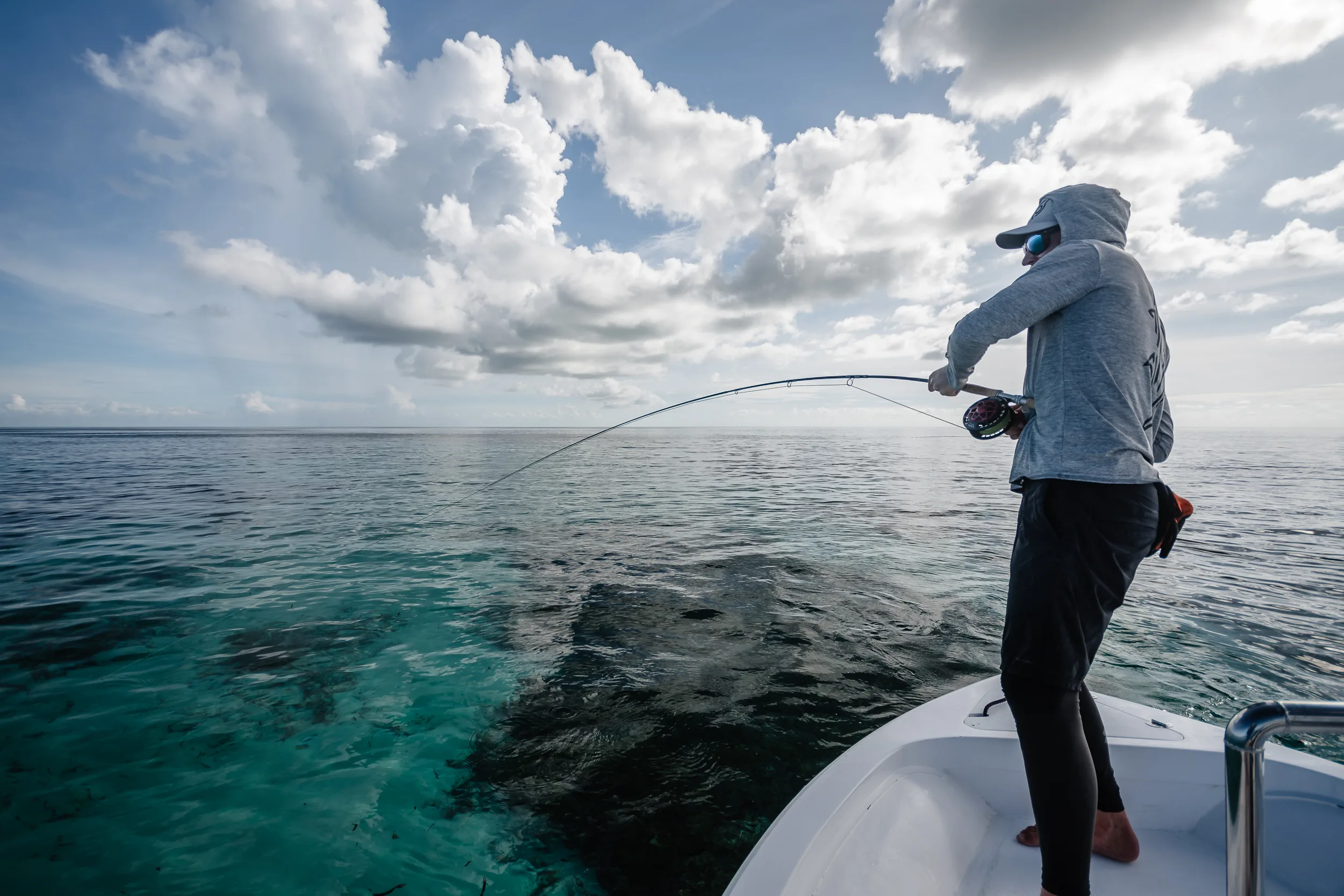 Angler casting from a skiff — Providence Atoll, Seychelles