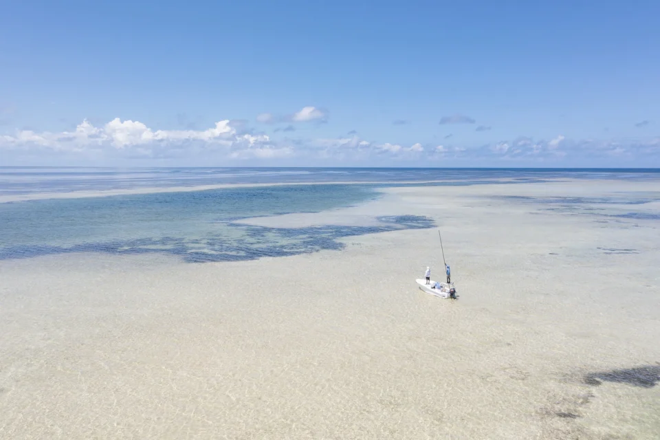 Angler wading a sand flat — Providence Atoll, Seychelles