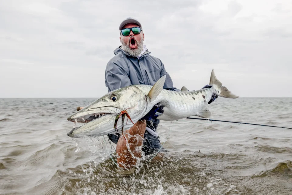 Angler with a barracuda — Providence Atoll, Seychelles