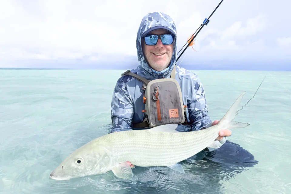 Angler with a bonefish — Providence Atoll, Seychelles