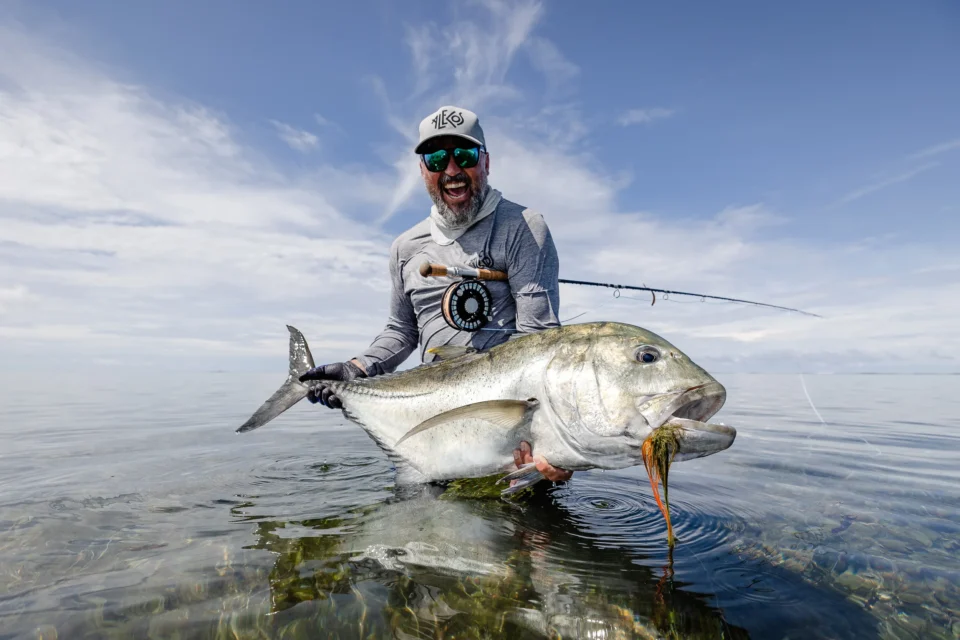 Angler with a giant trevally — Providence Atoll, Seychelles
