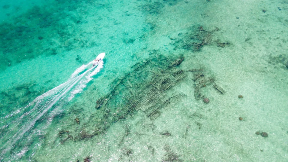 Skiff running the turquoise flats — Providence Atoll, Seychelles