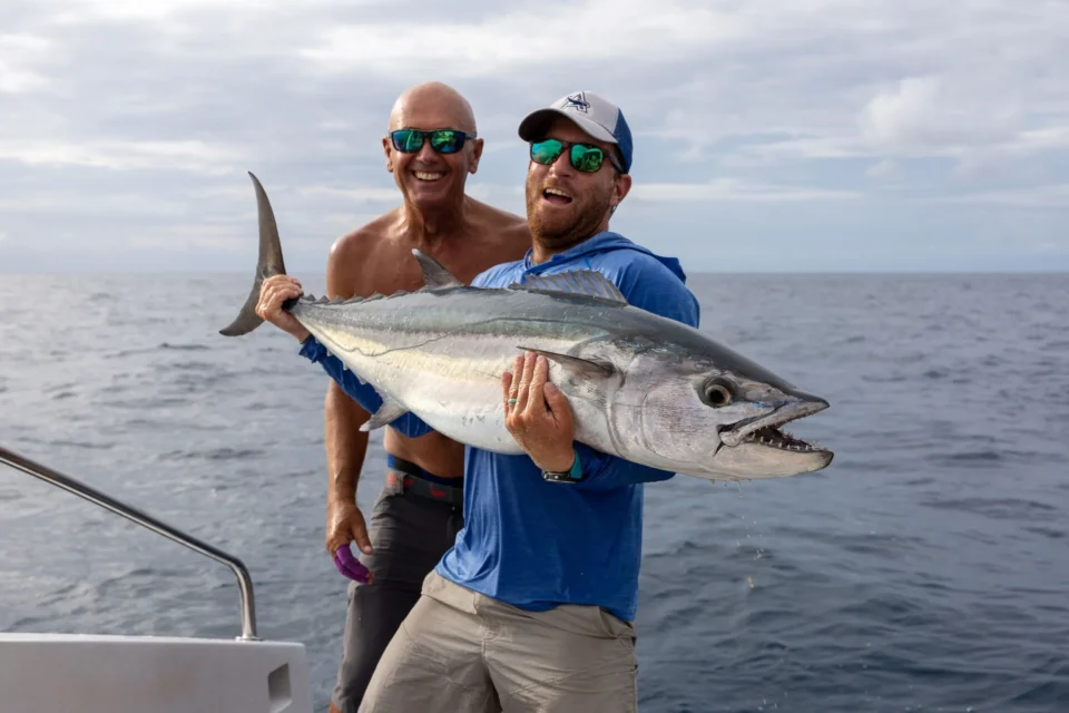 Two anglers with a dogtooth tuna — Providence Atoll, Seychelles
