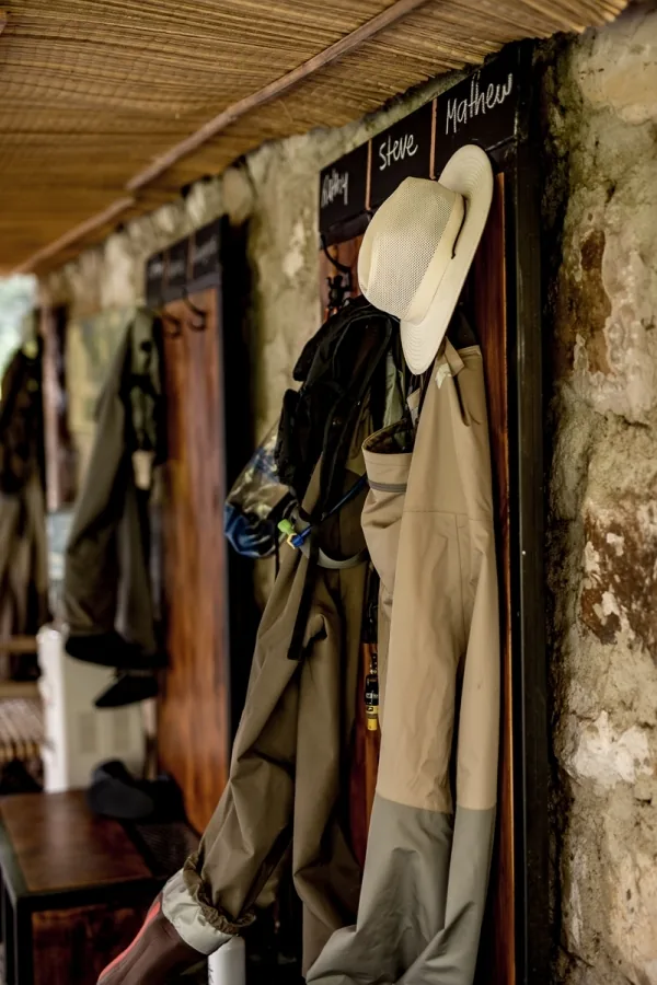 Wader room with hanging waders and jackets at Tipiliuke Lodge, Patagonia, Argentina