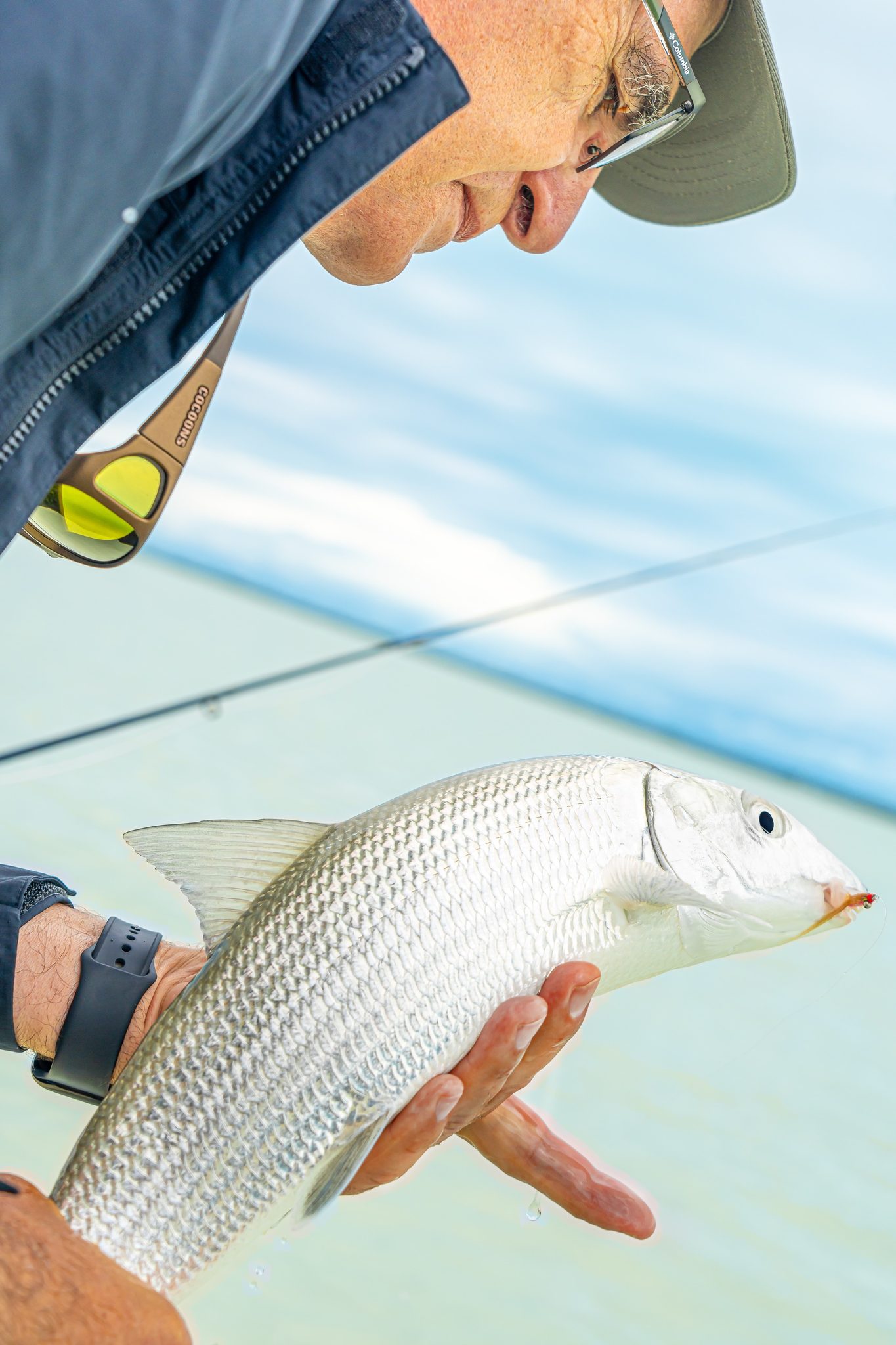 A bonefish held for a moment before release, Mangrove Cay. Photo Adam Campesi, Campesi Design.