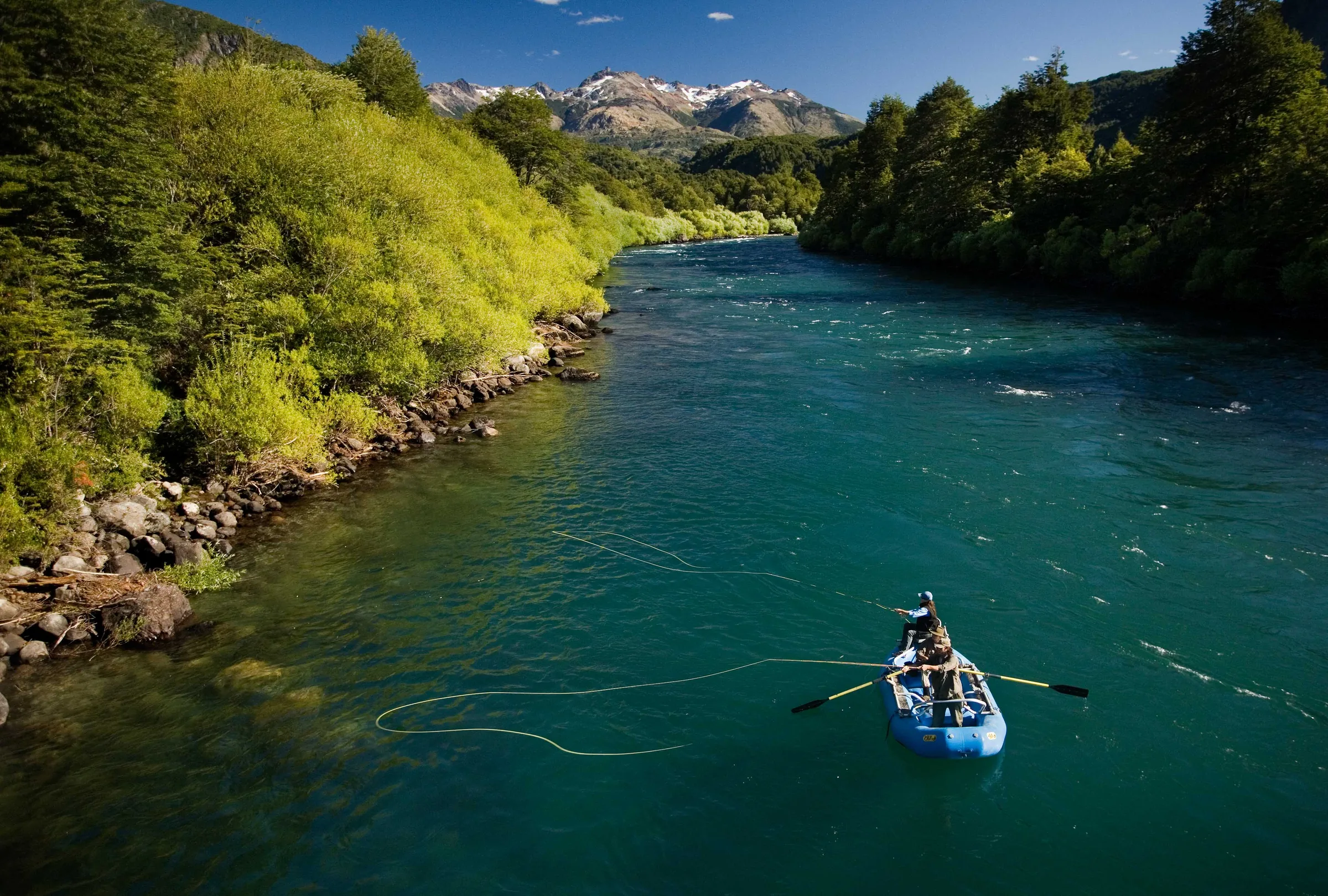 Paddler in a boat on the turquoise Futaleufú River at Futa Lodge, Chile