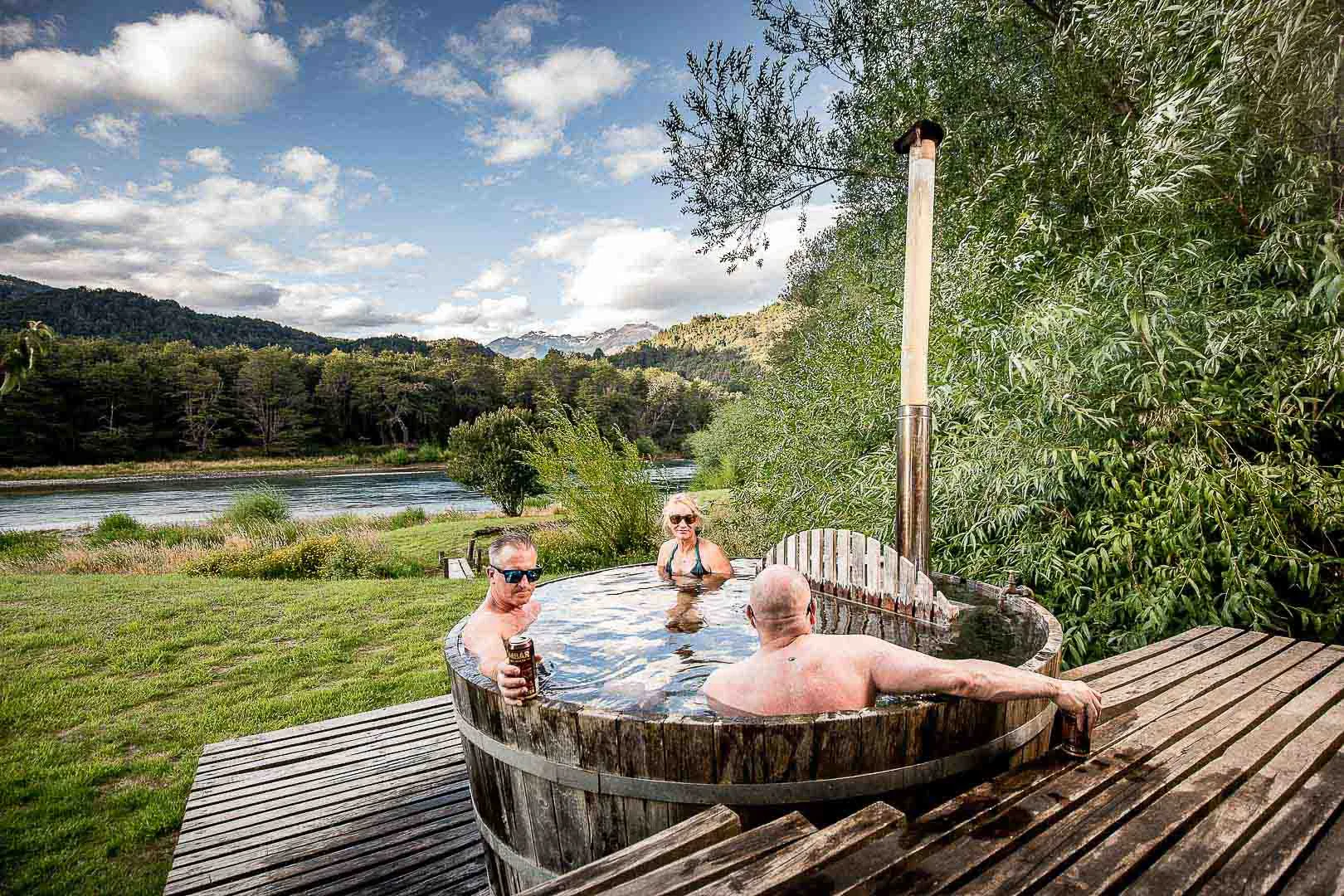 Outdoor wooden hot tub on a deck above the Futaleufú at Futa Lodge, Chile