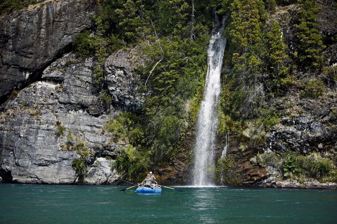 Blue raft below a waterfall on the Futaleufú River at Futa Lodge, Chile